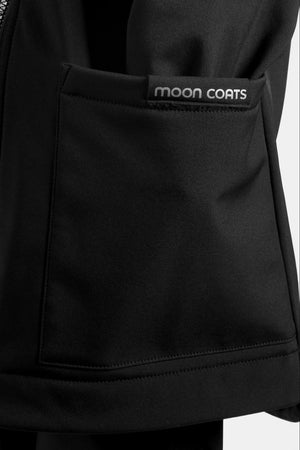 Close-up of a black jacket pocket with 'moon coats' branding.