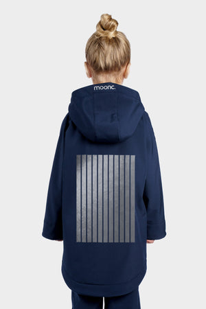 Person wearing a navy blue raincoat with a visible brand logo on a white background