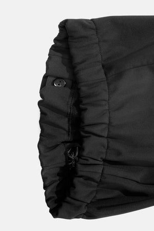 Close-up of a black softshell trousers adjustable waist on a white background